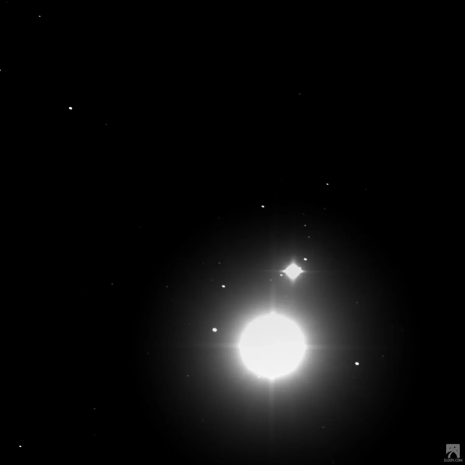 Jupiter and Saturn in the Great Conjunction: a bright blazing disc with a smaller point of light just above it.