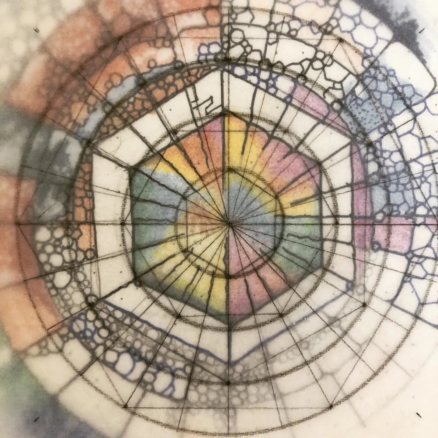 Ink drawing of a circular chart built around a hexagon, its spokes and rings softly washed in rainbow colours.