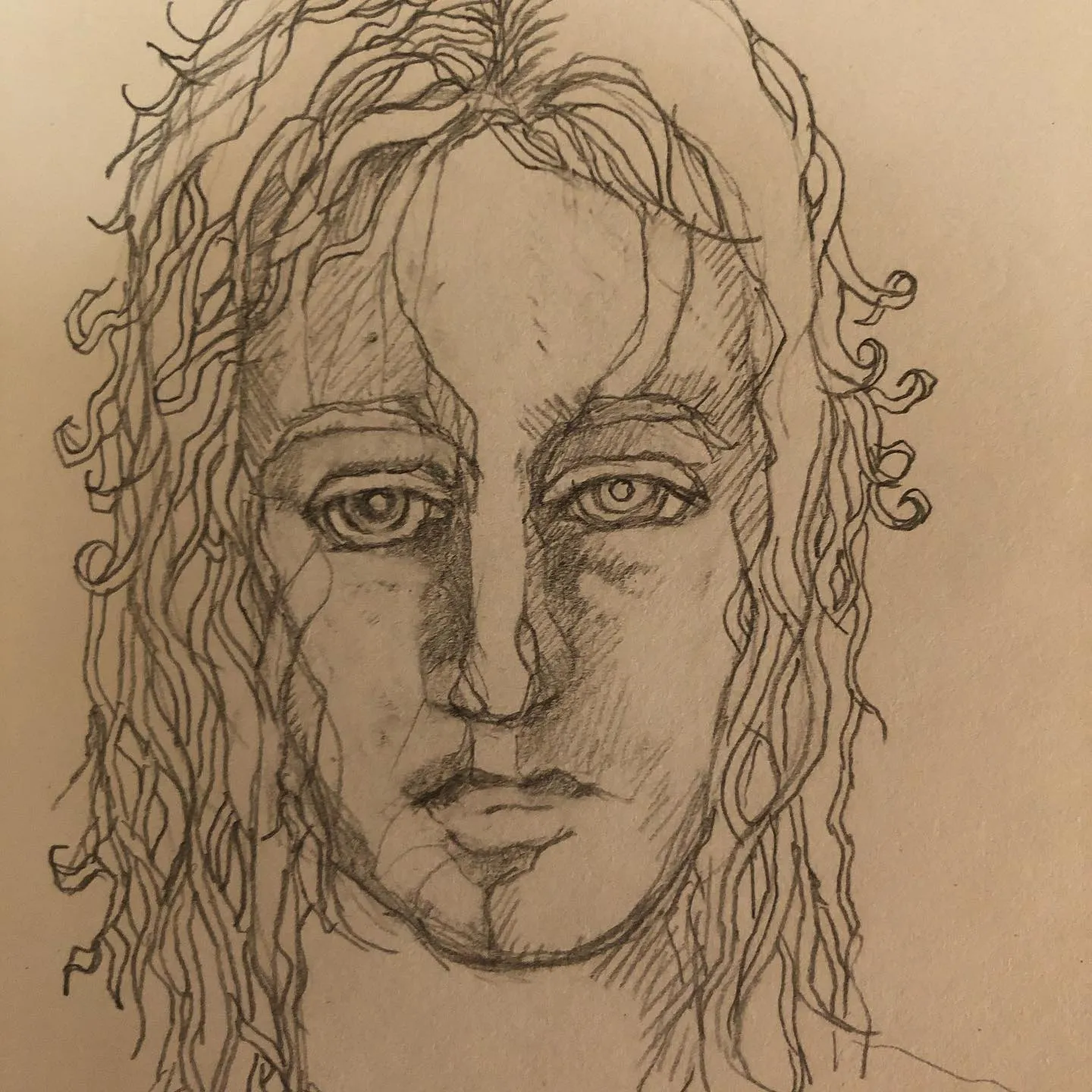 Pencil portrait of a face looking straight out, with long wavy hair falling over the shoulders, on warm-toned paper.