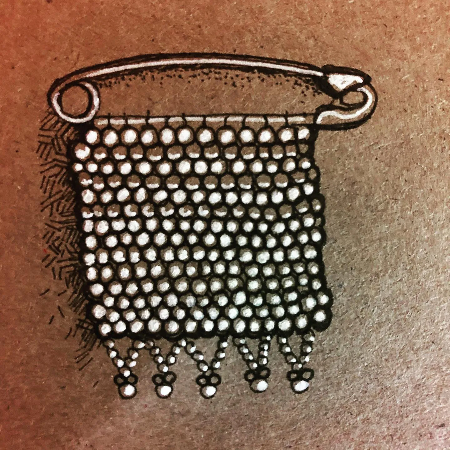 Ink and white pen drawing of a beaded panel hanging from a safety pin, in the style of Zulu beadwork, on brown paper.