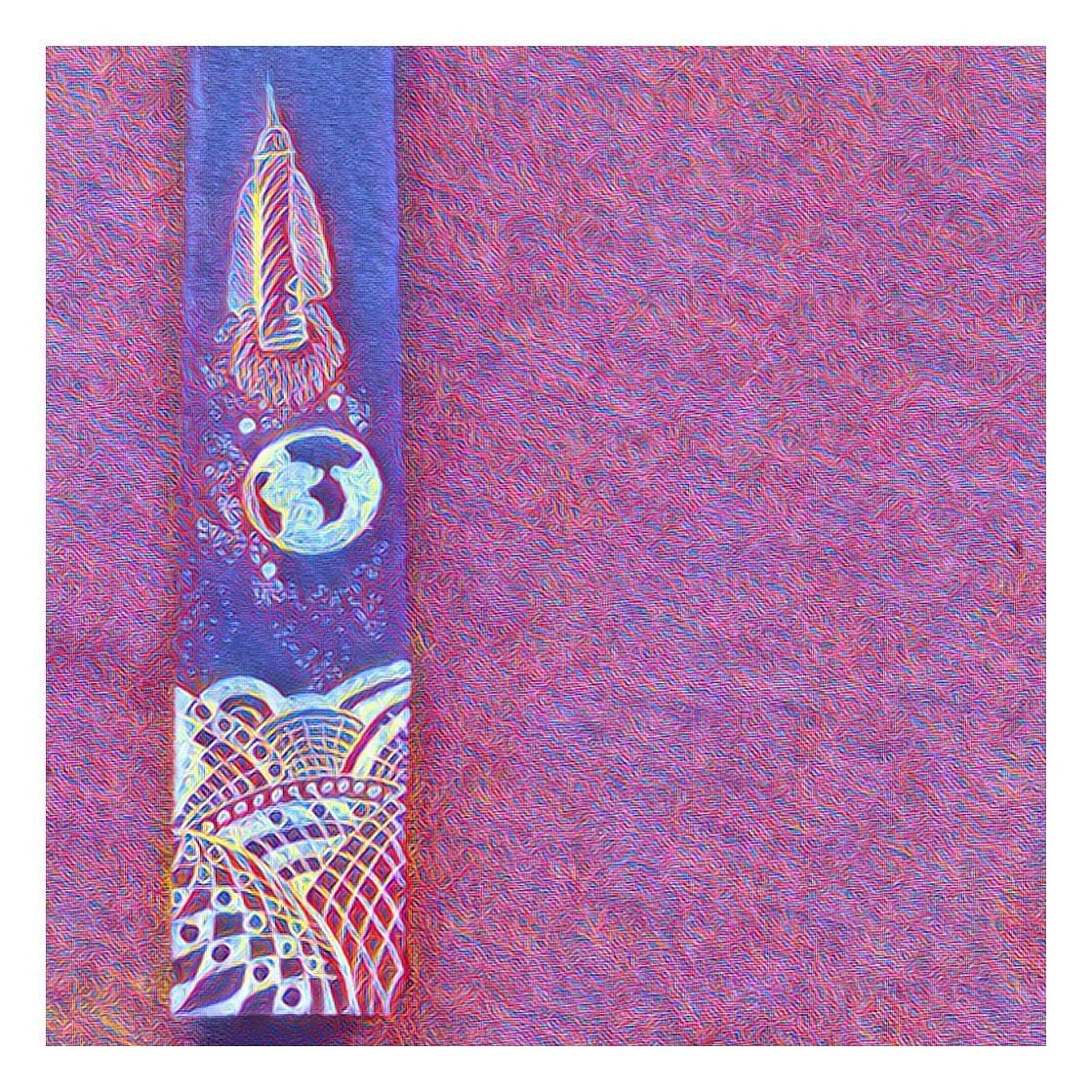 A narrow painted bookmark on red fabric, decorated in white ink with a rocket, a planet and swirling wave patterns.