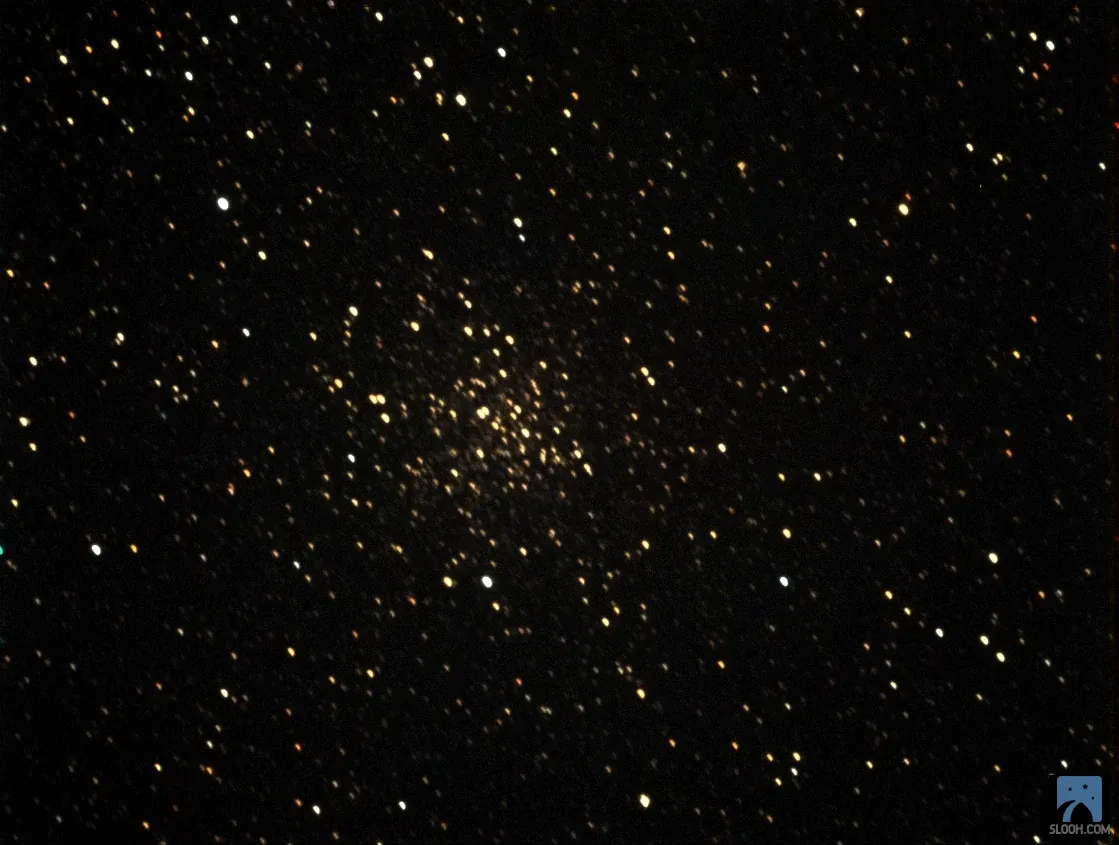 The globular cluster M71, a loose swarm of golden stars.